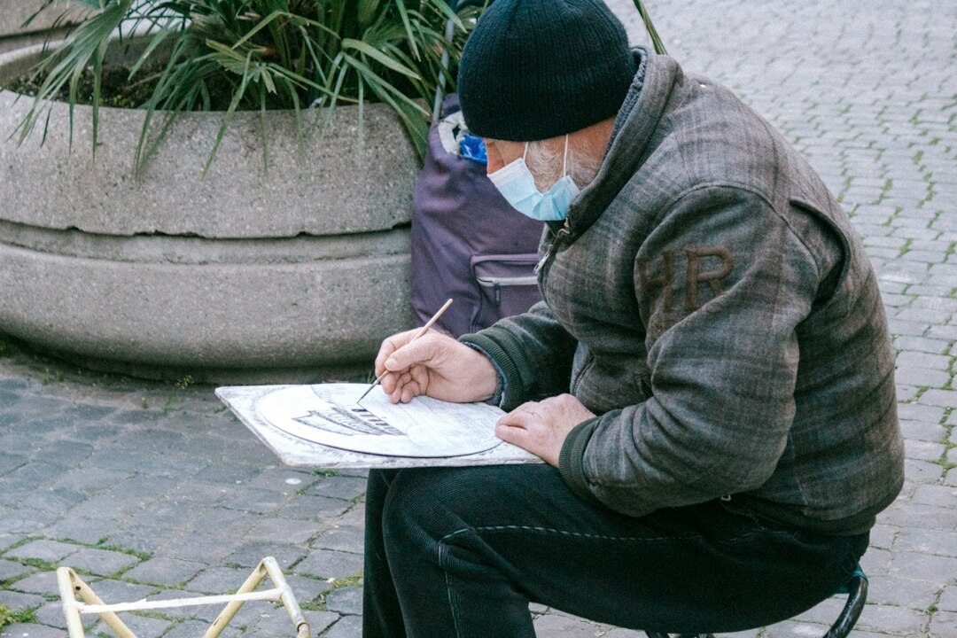man filling out survey form